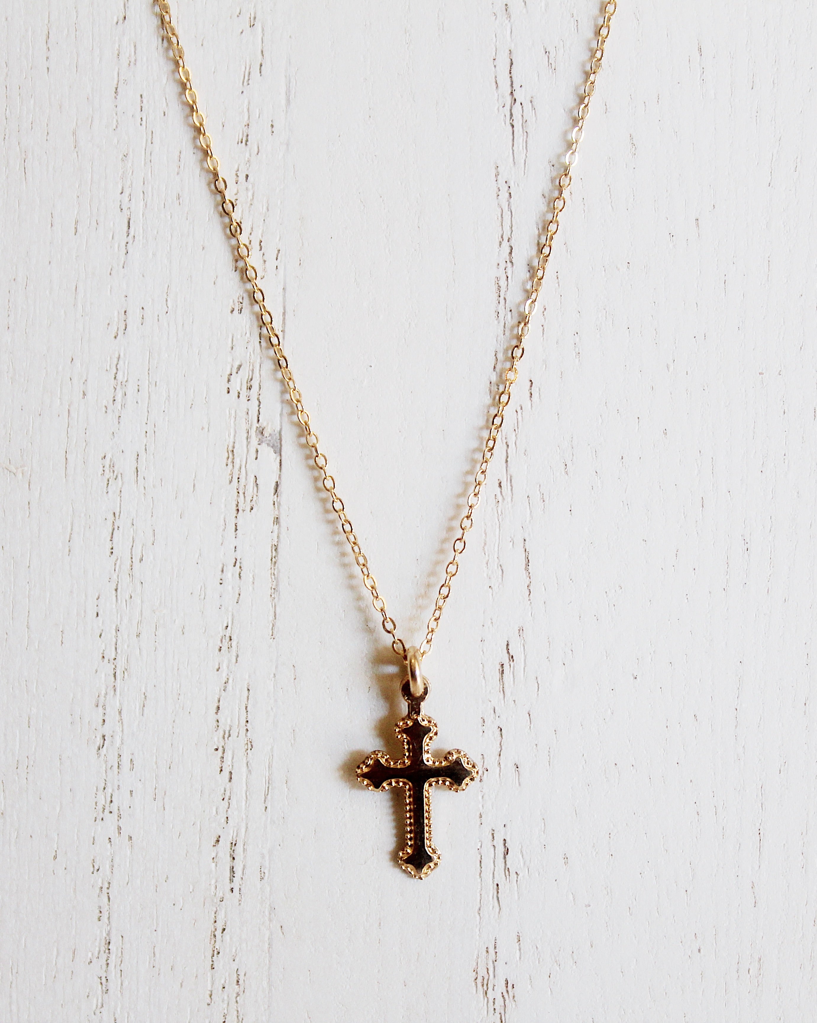 Gold baby cross on sale necklace